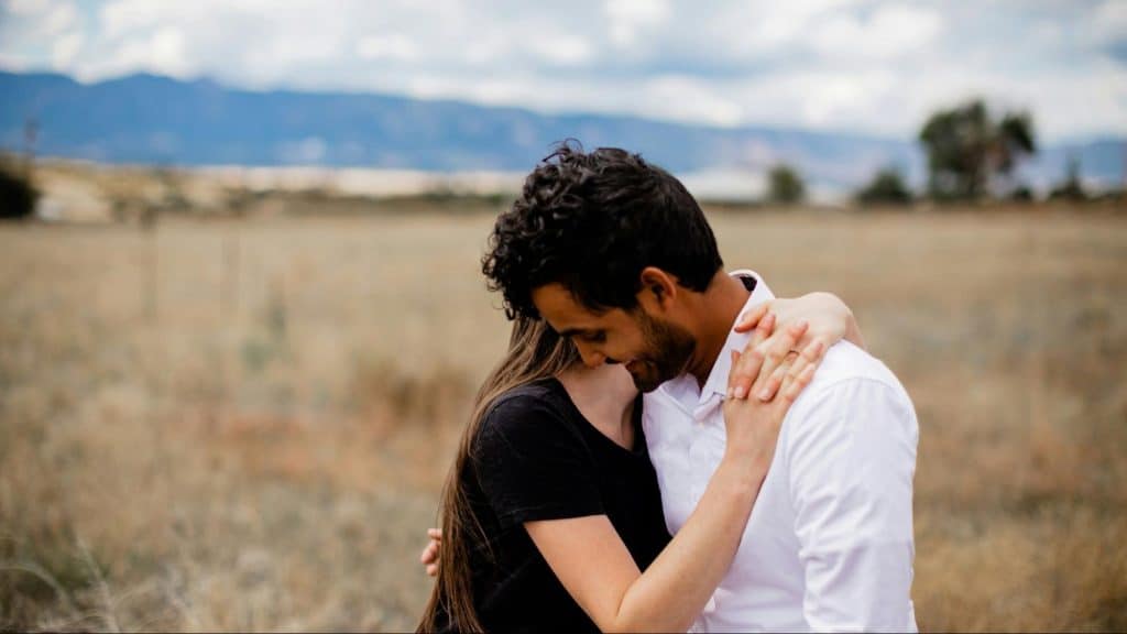 A man hugging a woman