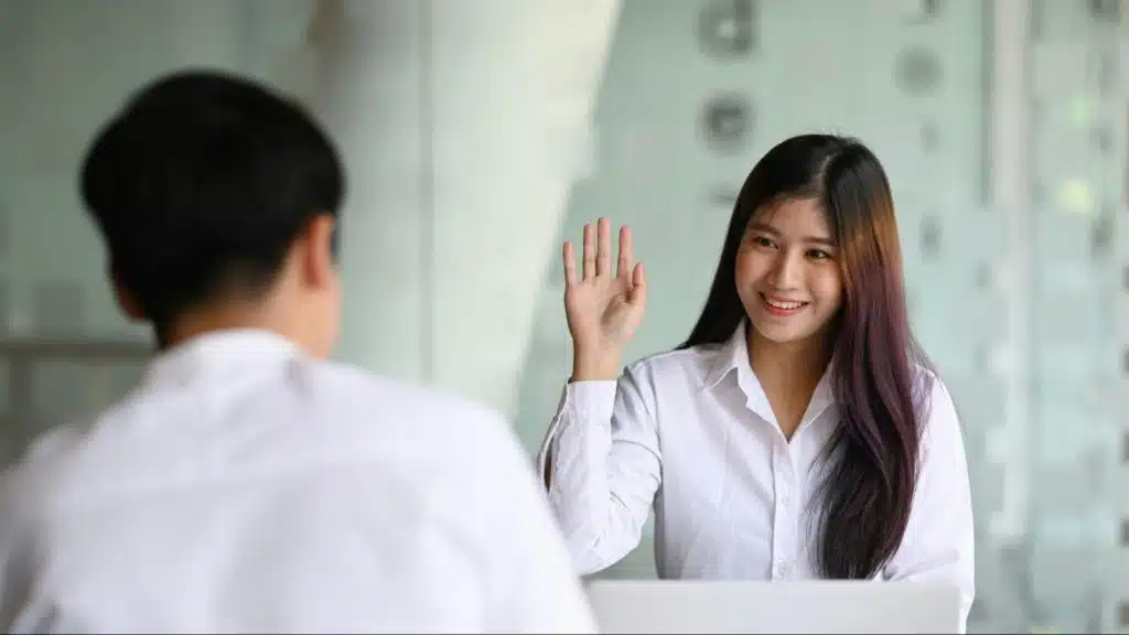 A woman waving at the woman