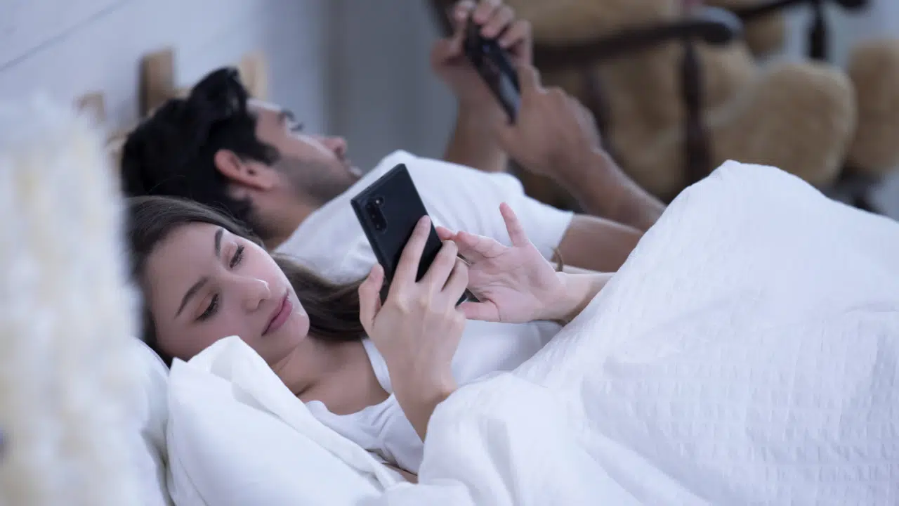 A couple busy with their phones 