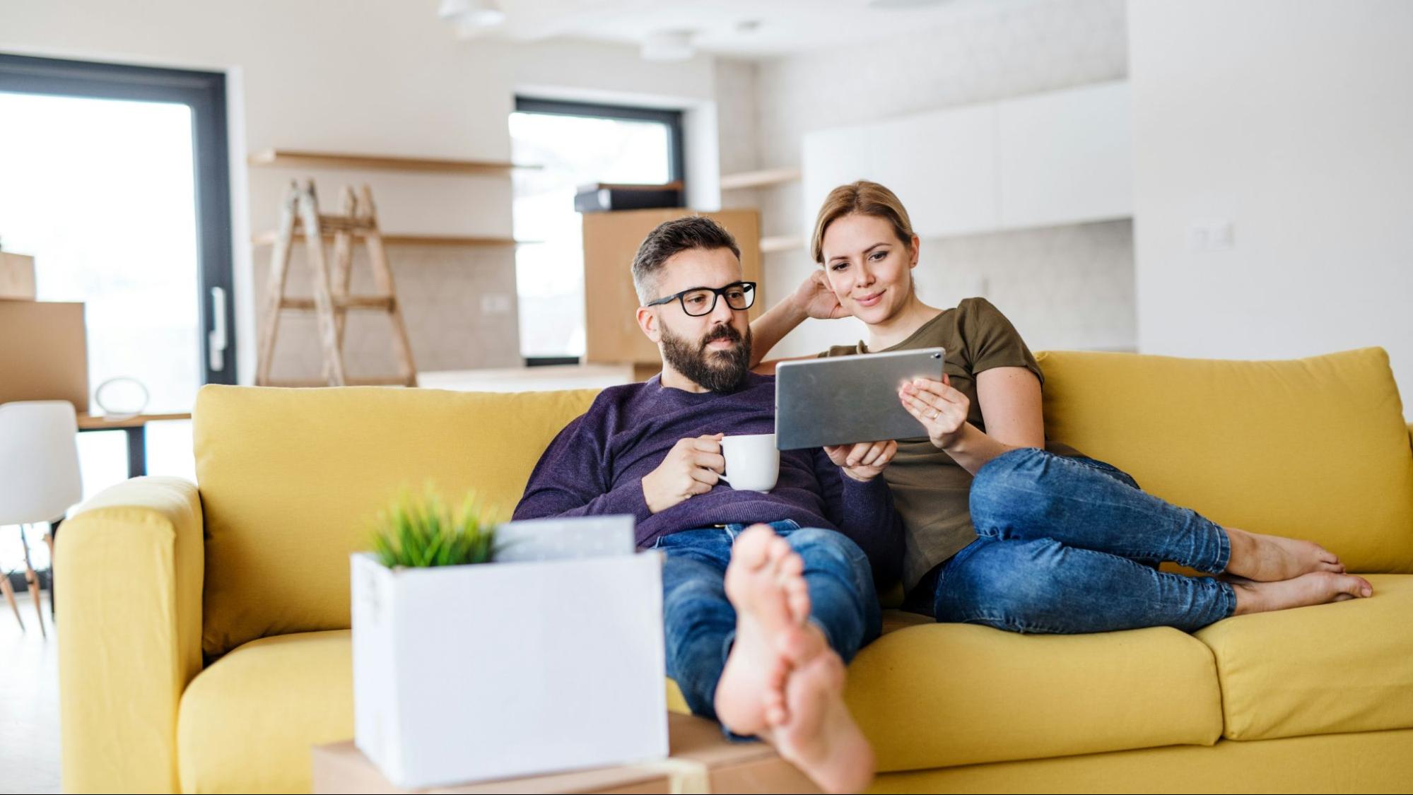 A man and woman at the couch