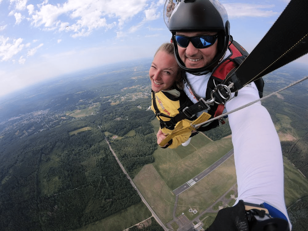 A man and a woman skydiving