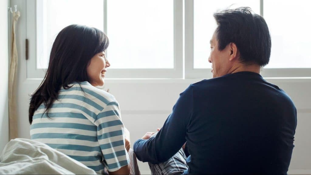 A man and woman looking at each other