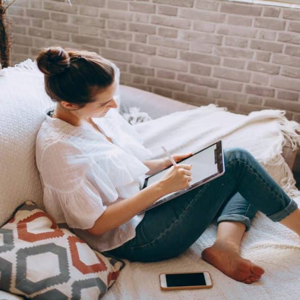 A woman writing at home
