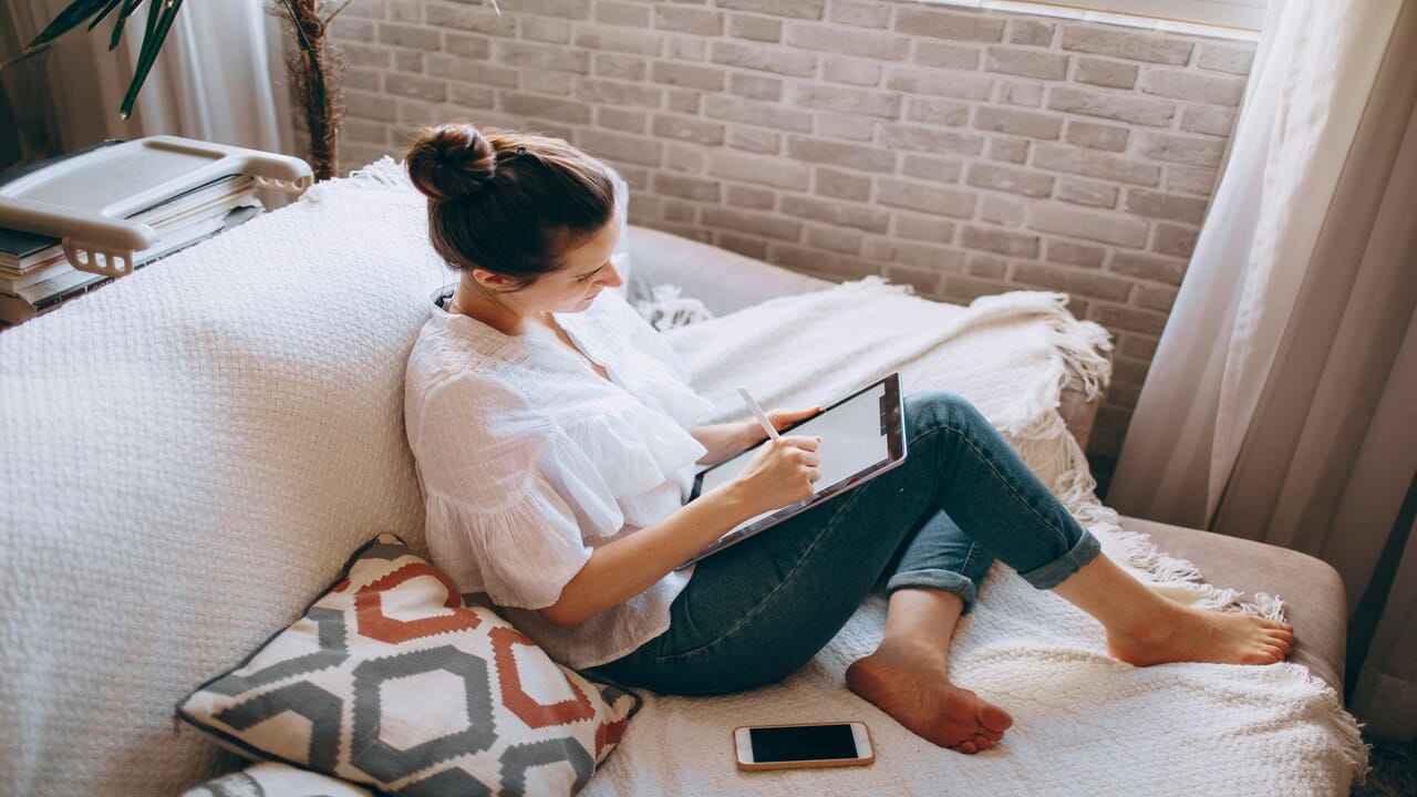 A woman writing at home
