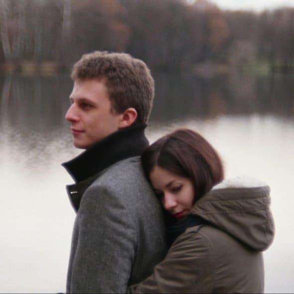 A woman hugging a man from behind
