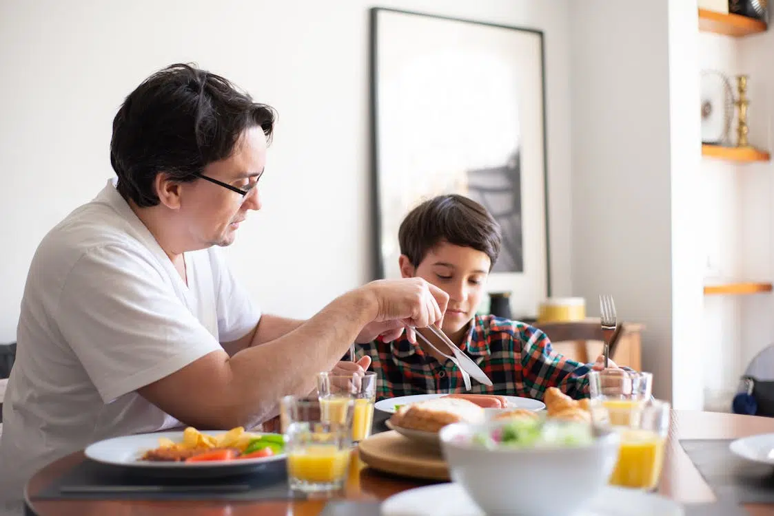 A father and his son at the table