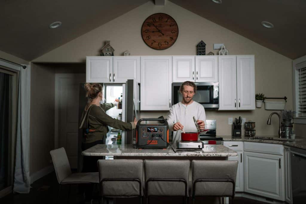 A man and woman at the kitchen