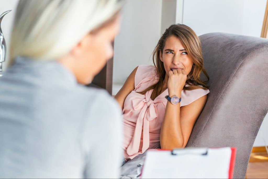 A woman thinking about what to say about her husband