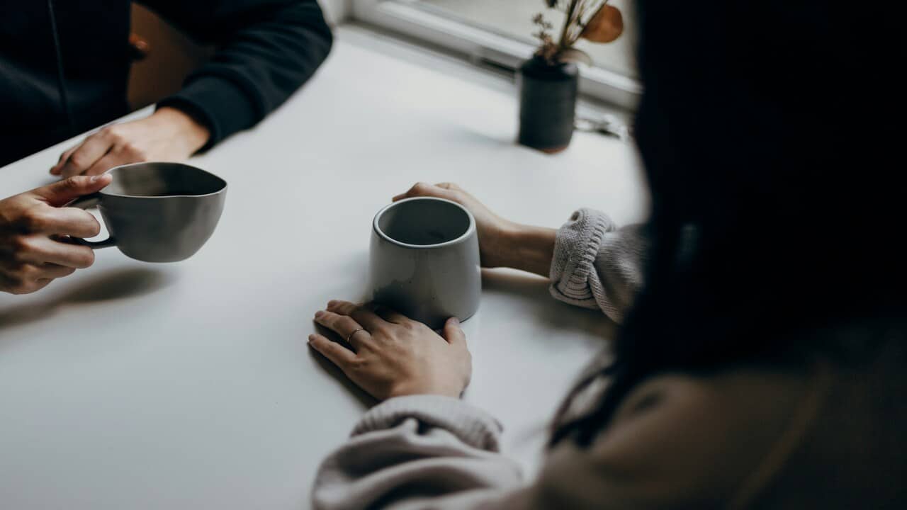 A couple having coffee together