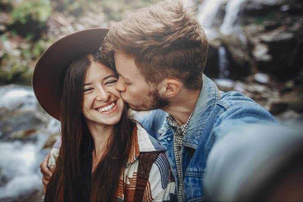 A man kissing a woman