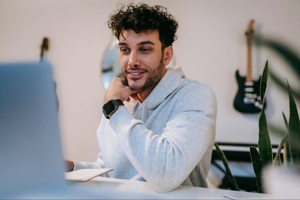 A man in front of his laptop