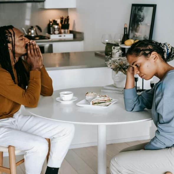 A couple looking upset while talking