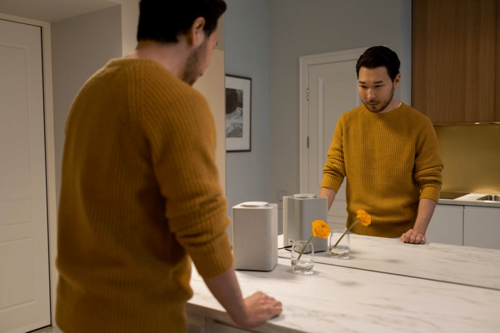 A man standing in front of a mirror