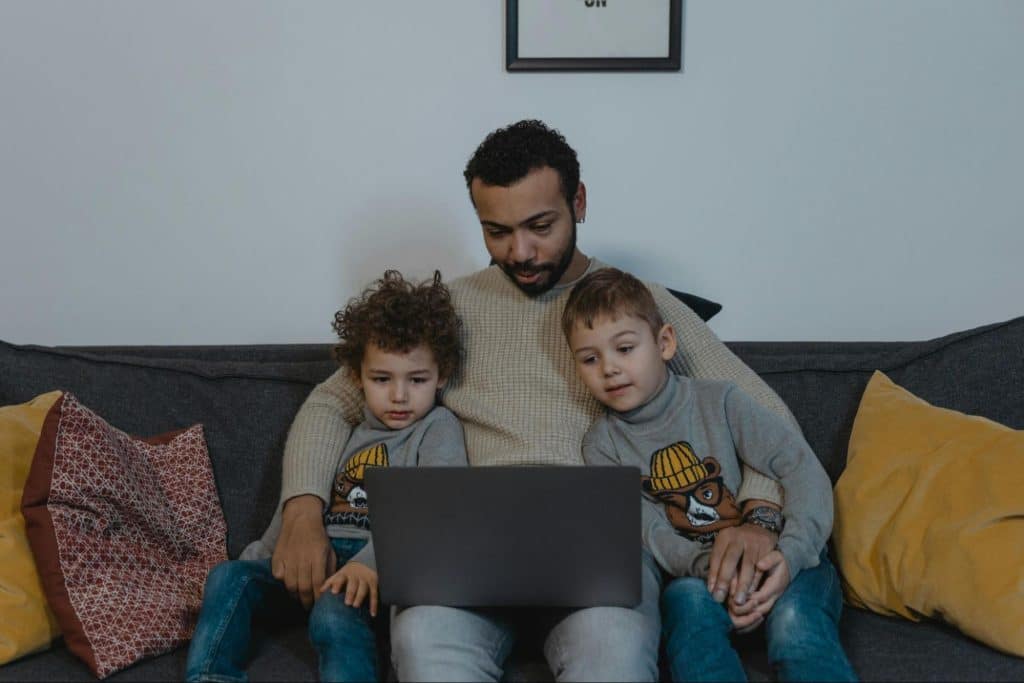 A man working while with his kids 