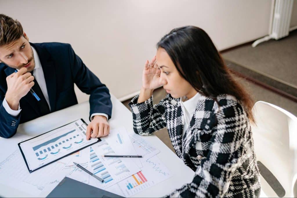 A man questioning a woman 