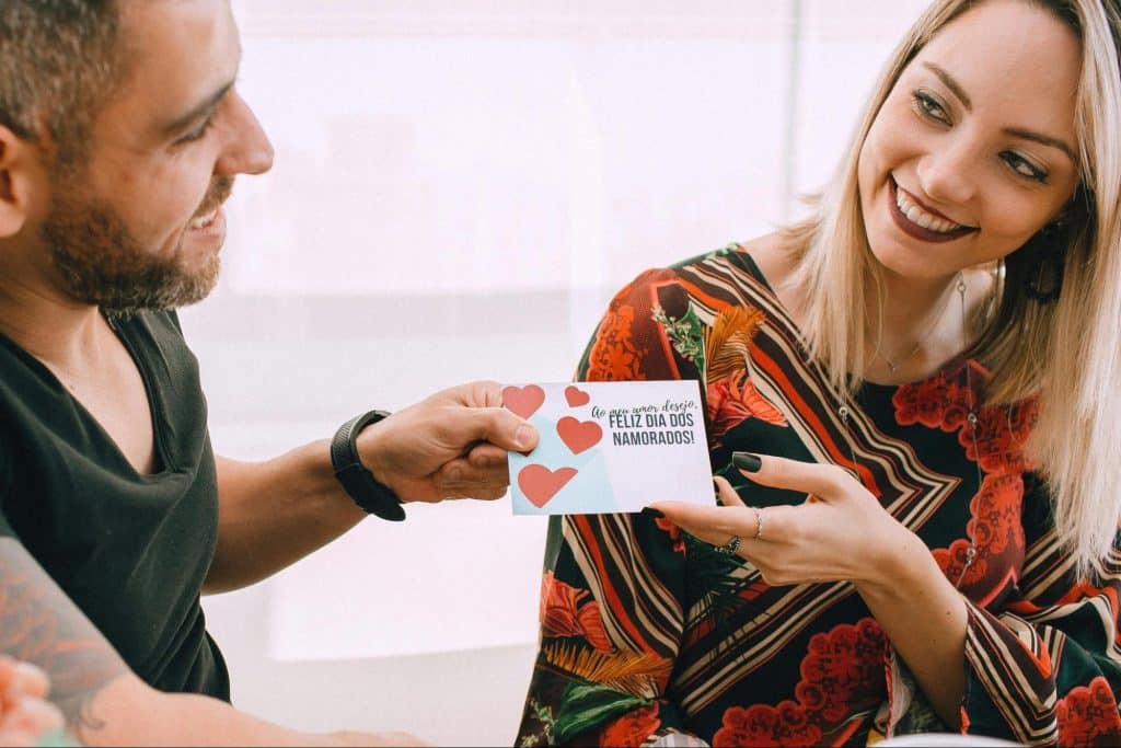 A man giving a gift to woman