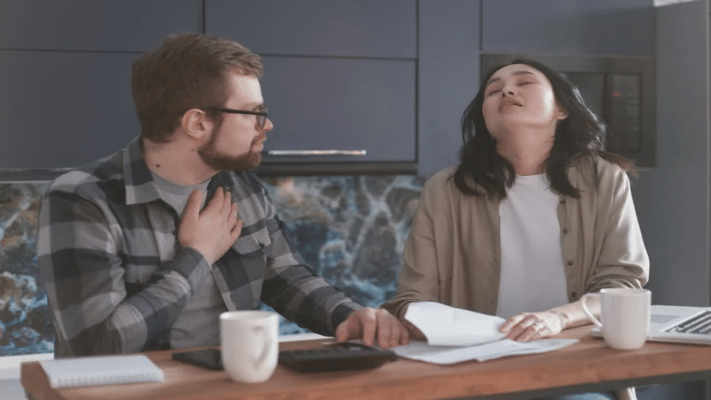 A couple talking about the bills 