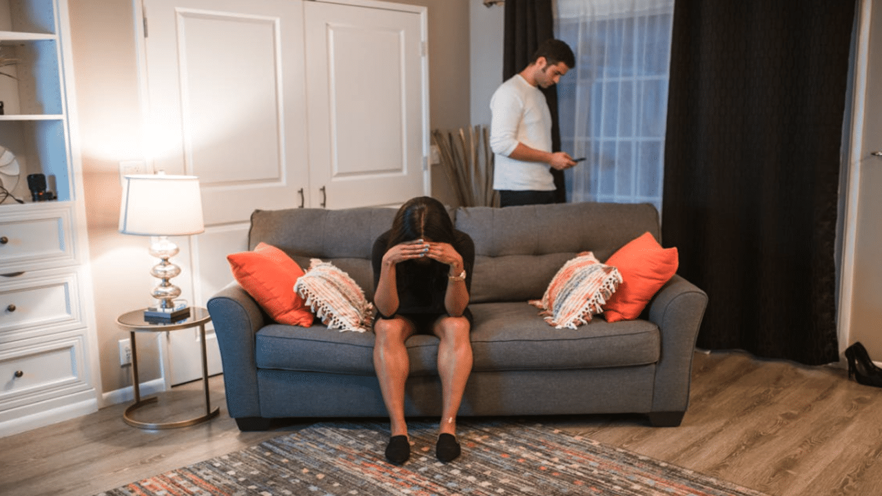 A couple ignoring each other at home