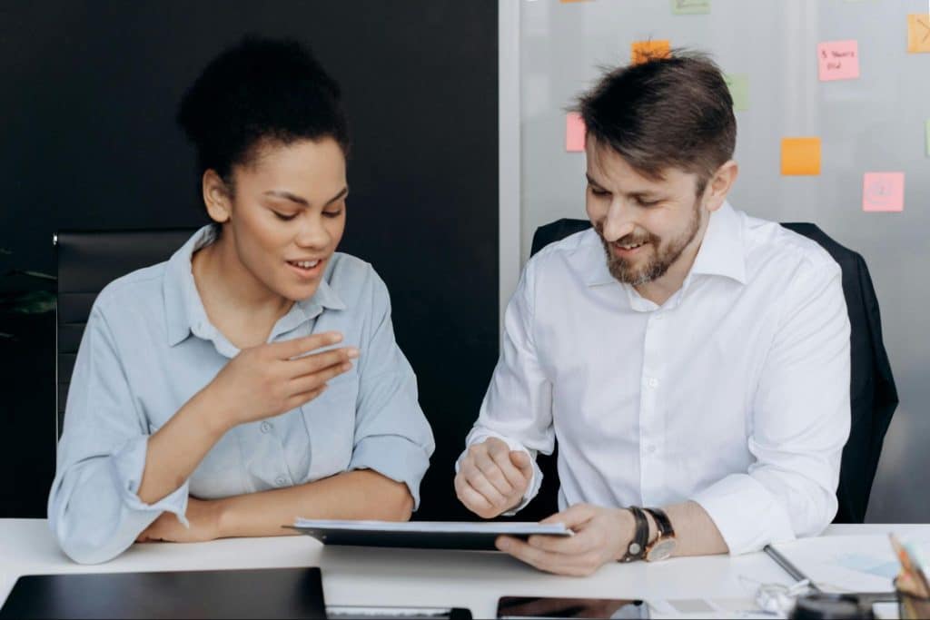 A man teaching a woman