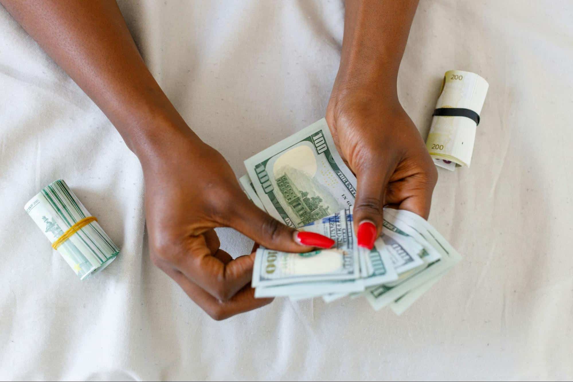A woman holding a money