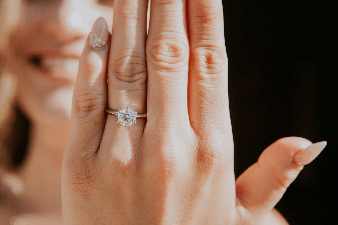 A woman wearing a diamond ring