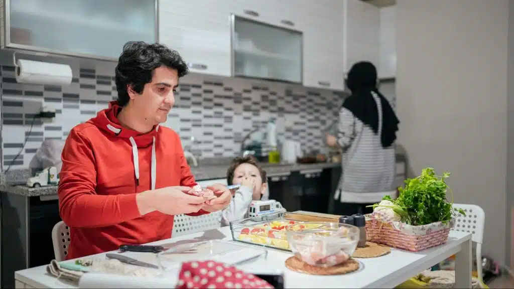 A man not helping a woman to prepare foods