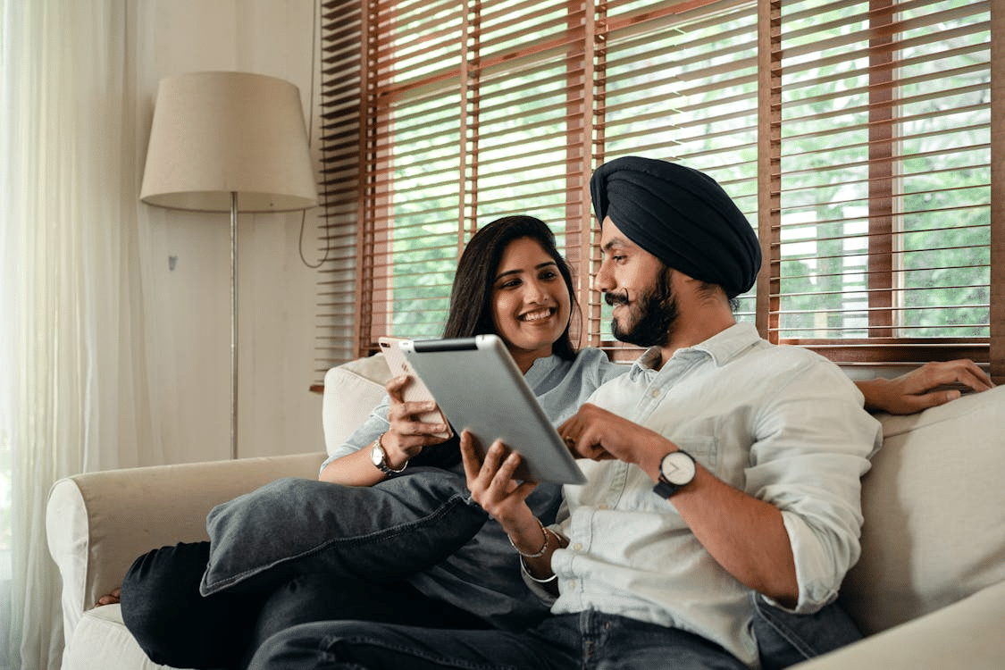 A couple using their tablets