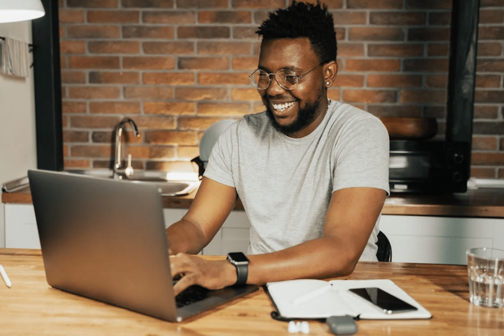 Man happily working and making plans
