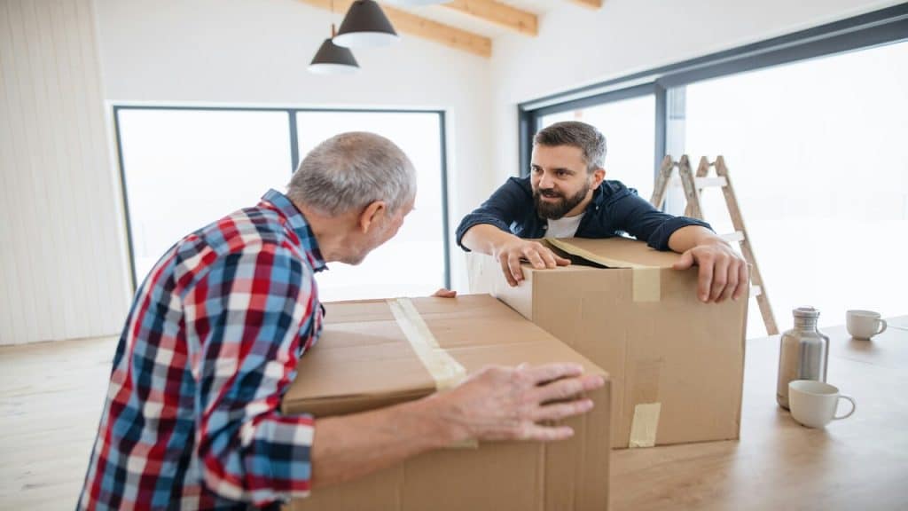 A man helping his father move