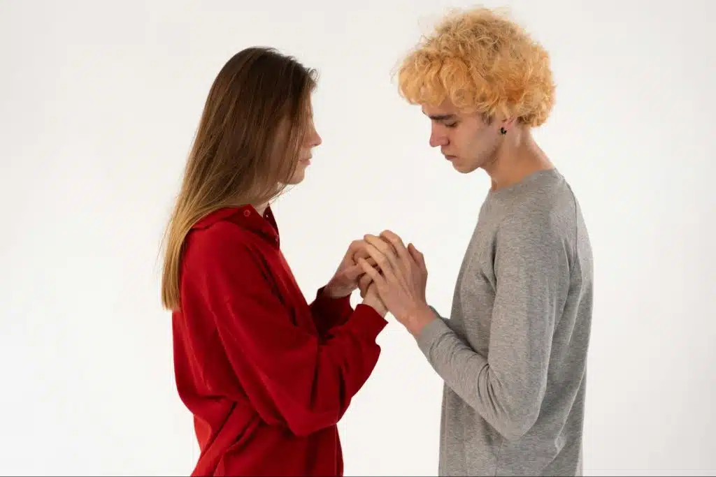 A man and woman holding hands