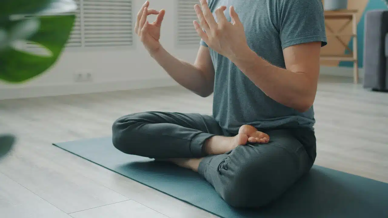 A man doing yoga at home