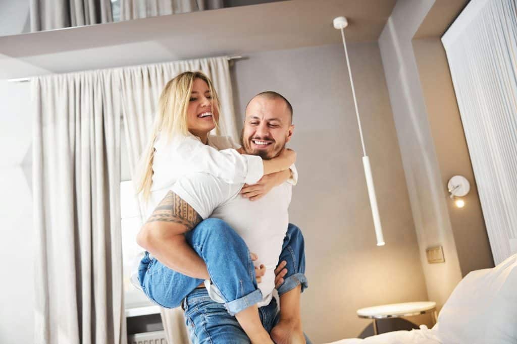 A picture of a husband carrying his wife