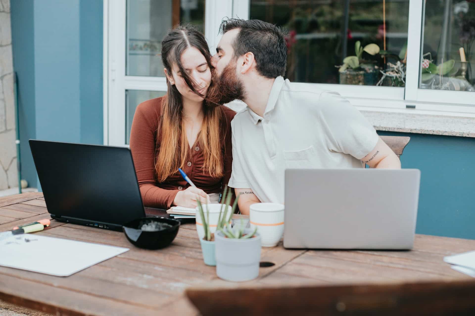 A man kissing a woman