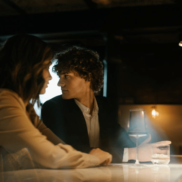 A man and a woman at a bar