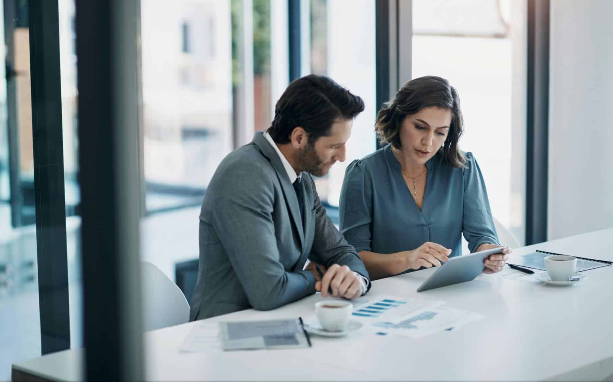 A man and woman checking something
