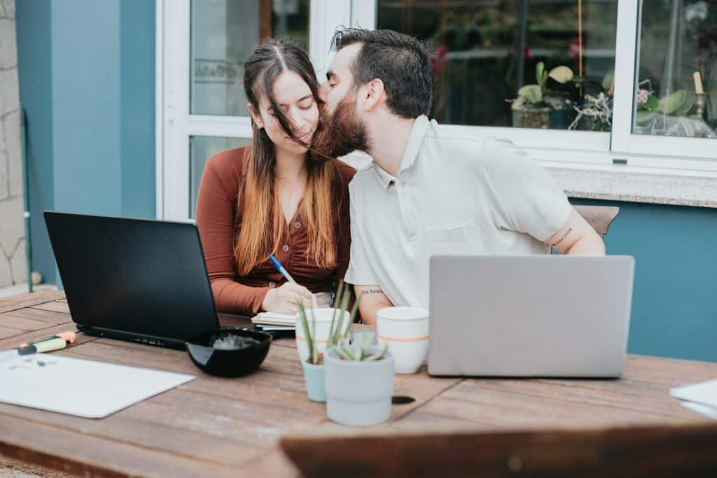 A man kissing a woman