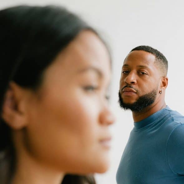 A man and a woman looking at each other.