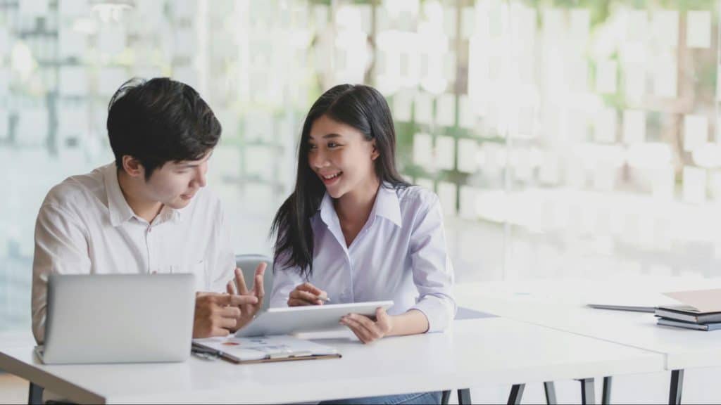 A man trying to teach a woman