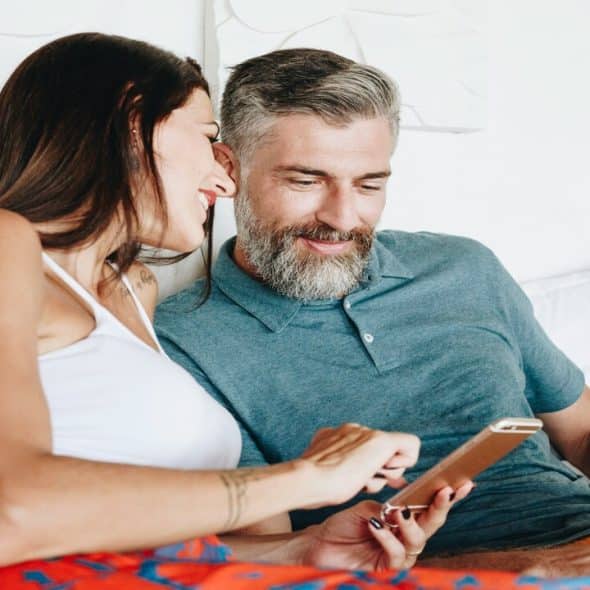 A couple looking at something on the phone
