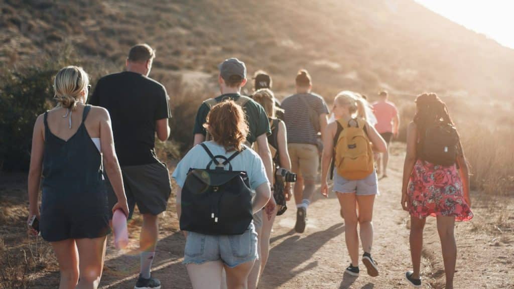 A group of people hiking on a track.