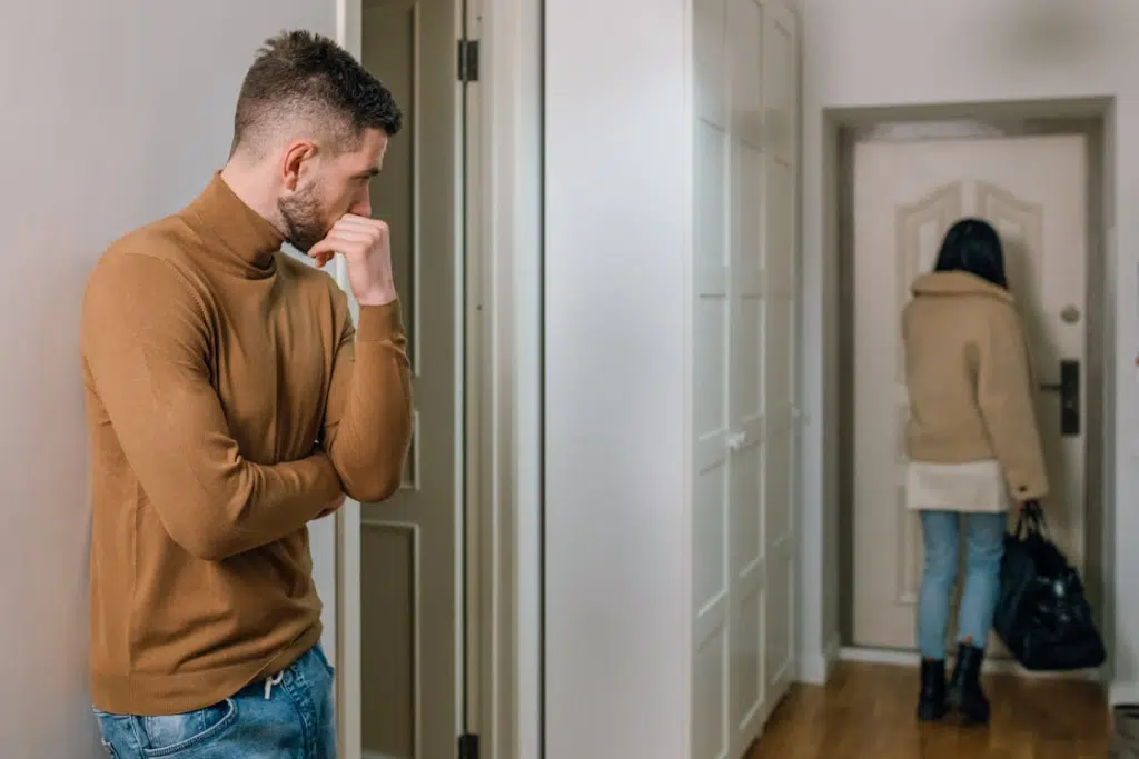 A man watching a woman leave