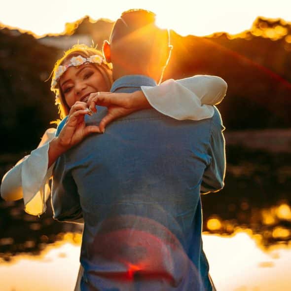 A woman hugging a man