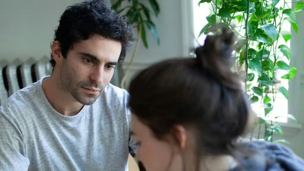 A man looking at the woman