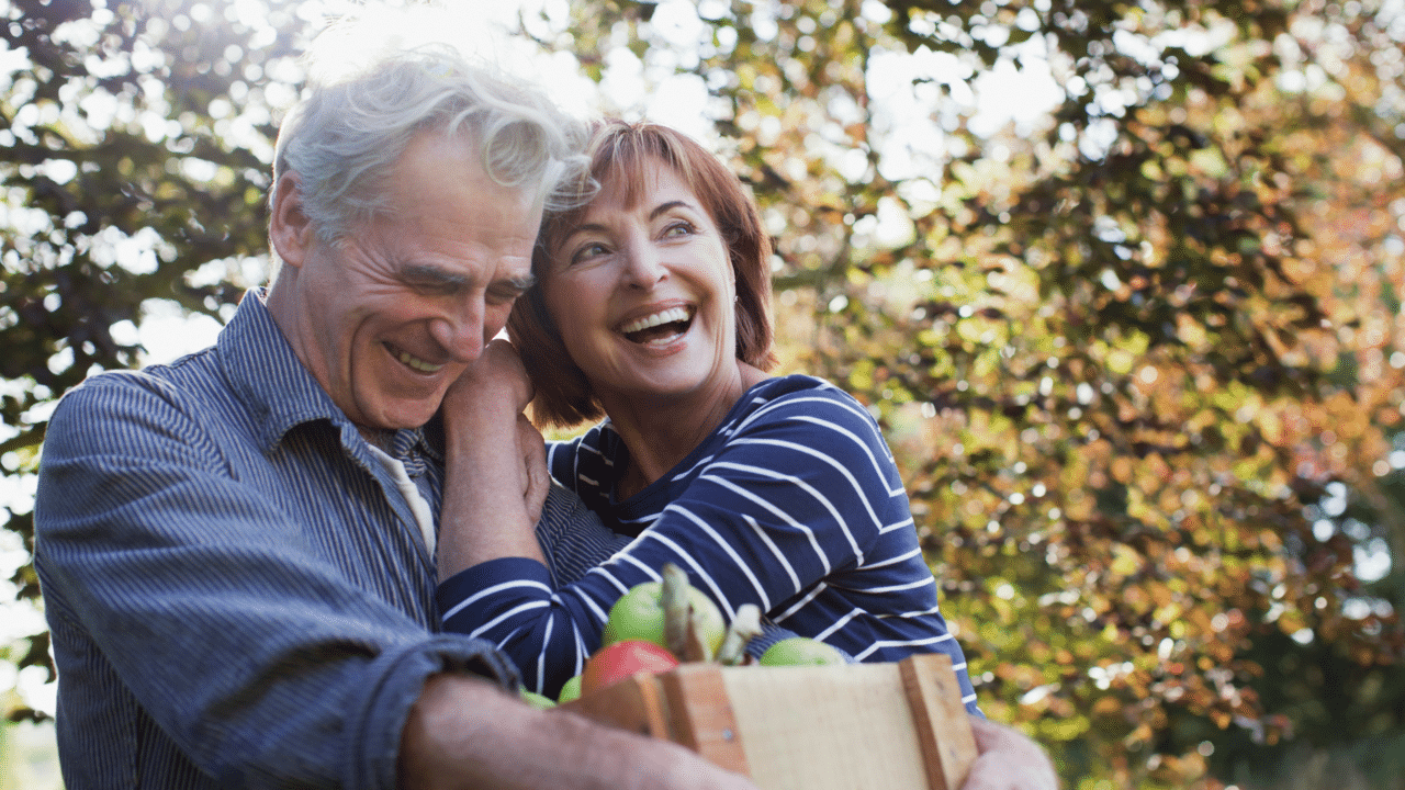 A mature couple just getting back from grocery shopping