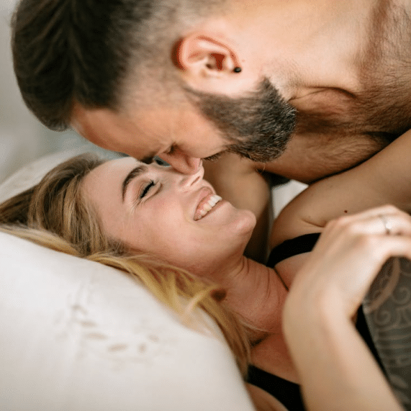 A couple cuddling at home together