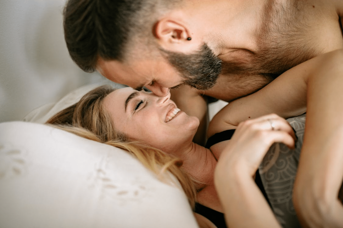 A couple cuddling at home together