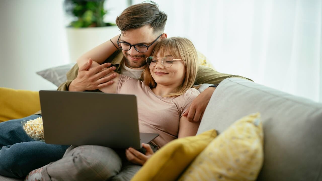 A couple looking at the wife’s laptop