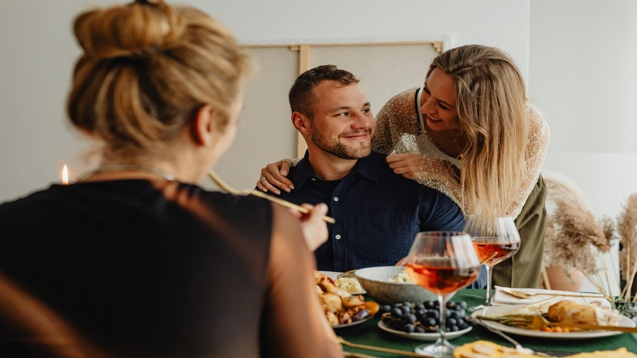 A couple hosting a dinner party