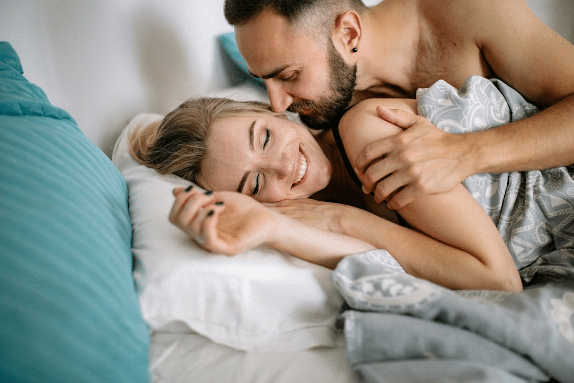 A couple cuddling at home together