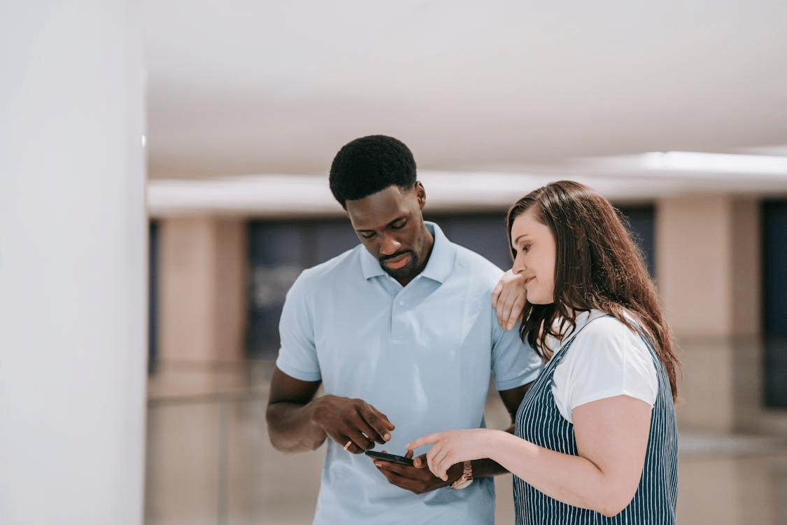 A couple looking at the phone